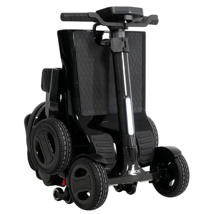 Folding mobility scooter in black carbon fiber finish, shown in folded position with tiller collapsed and four wheels