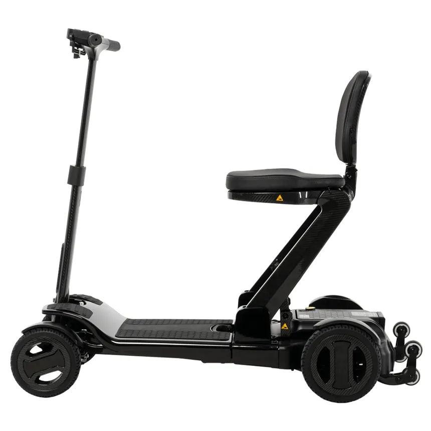 Folding power mobility scooter in black carbon finish with padded seat, backrest, tiller, and four wheels, shown from the