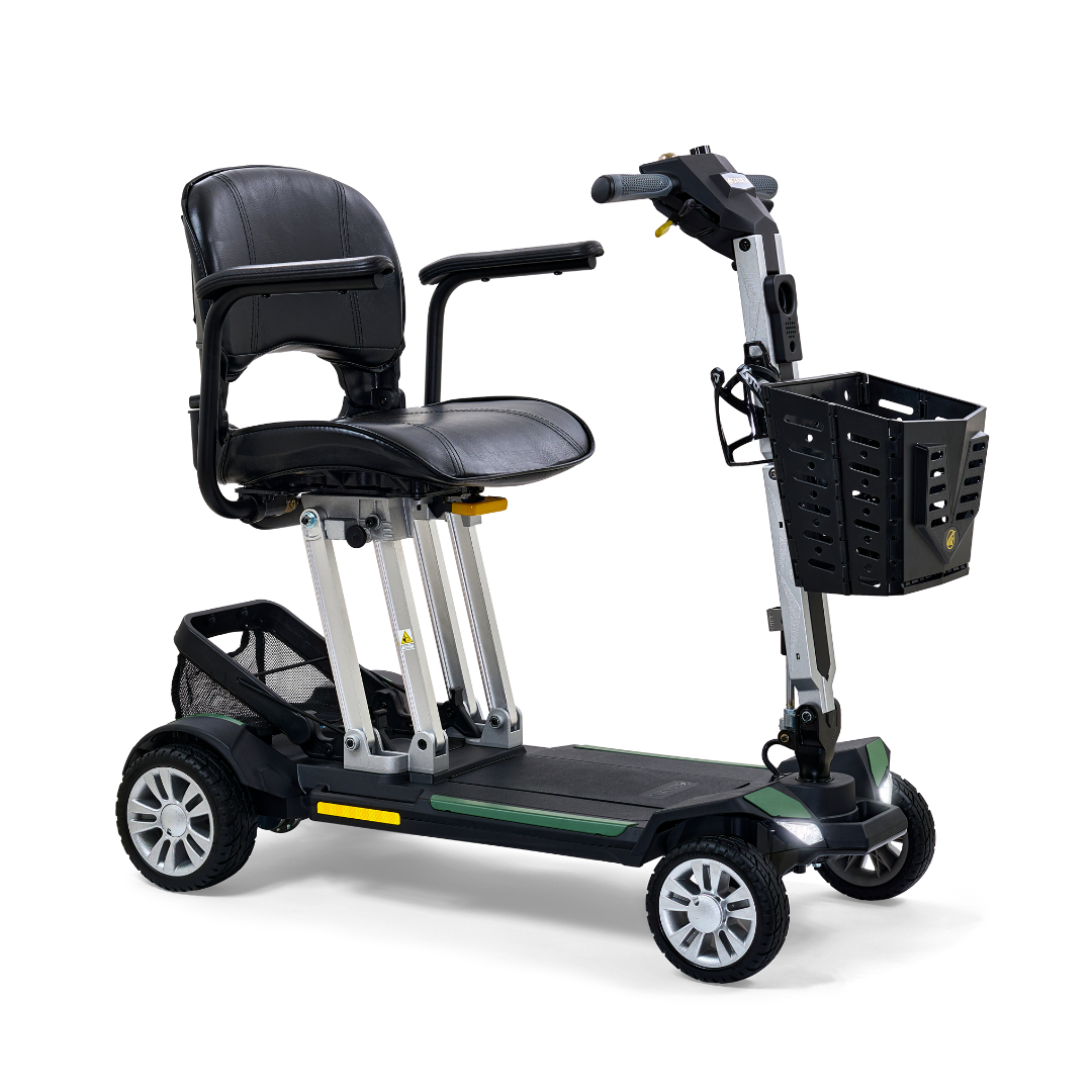 Four-wheel folding mobility scooter in black and green with padded seat, tiller handlebars, front basket, and rear storage