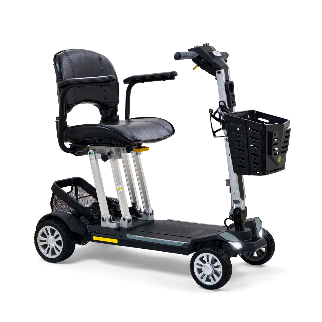 Four-wheel folding mobility scooter with black padded seat, tiller handlebar, front basket, and silver frame on white