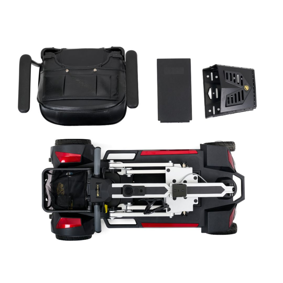 Power scooter disassembled into components: black seat with armrests, battery pack, footrest, and red and black folded base