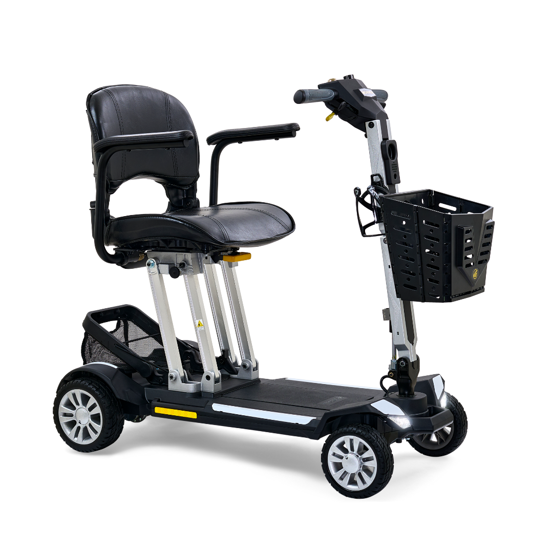 Folding power mobility scooter in black and silver with padded seat, tiller handlebars, front basket, and four wheels