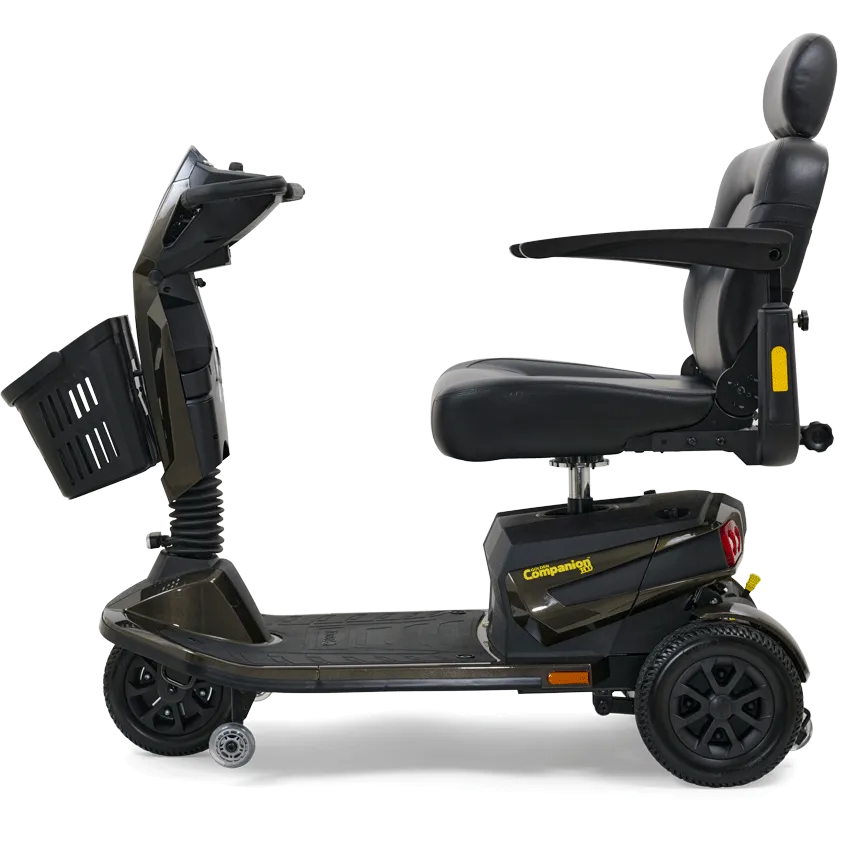 3-wheel power mobility scooter in dark gray with padded captain's seat, headrest, armrests, tiller, and front storage basket