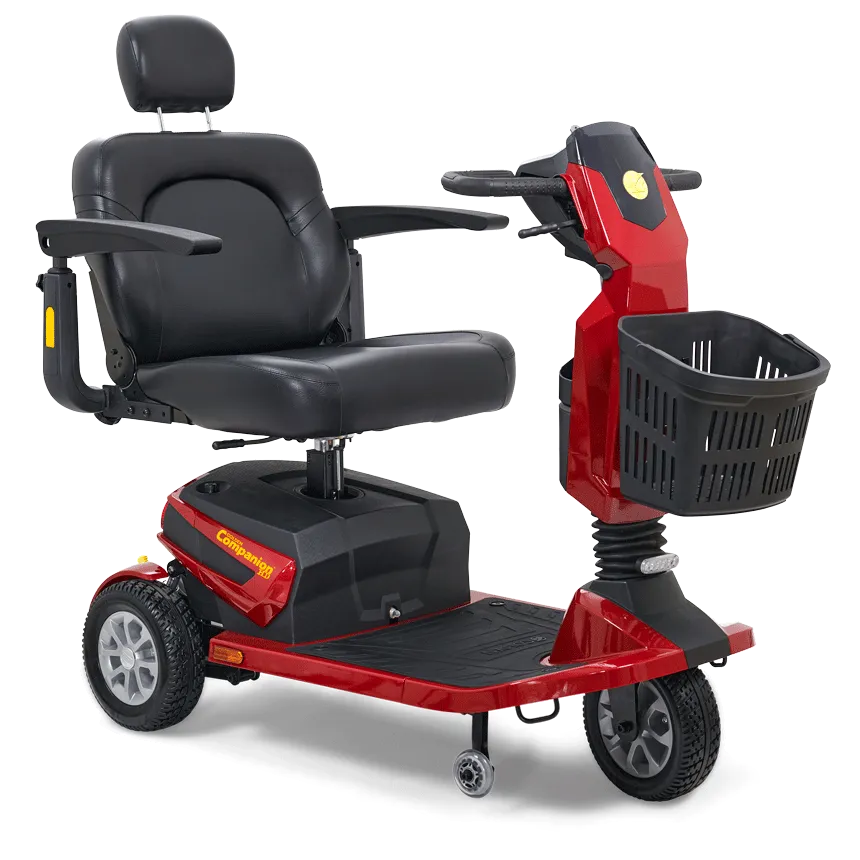 3-wheel mobility scooter in red with black padded captain's seat, headrest, armrests, tiller steering, and front storage