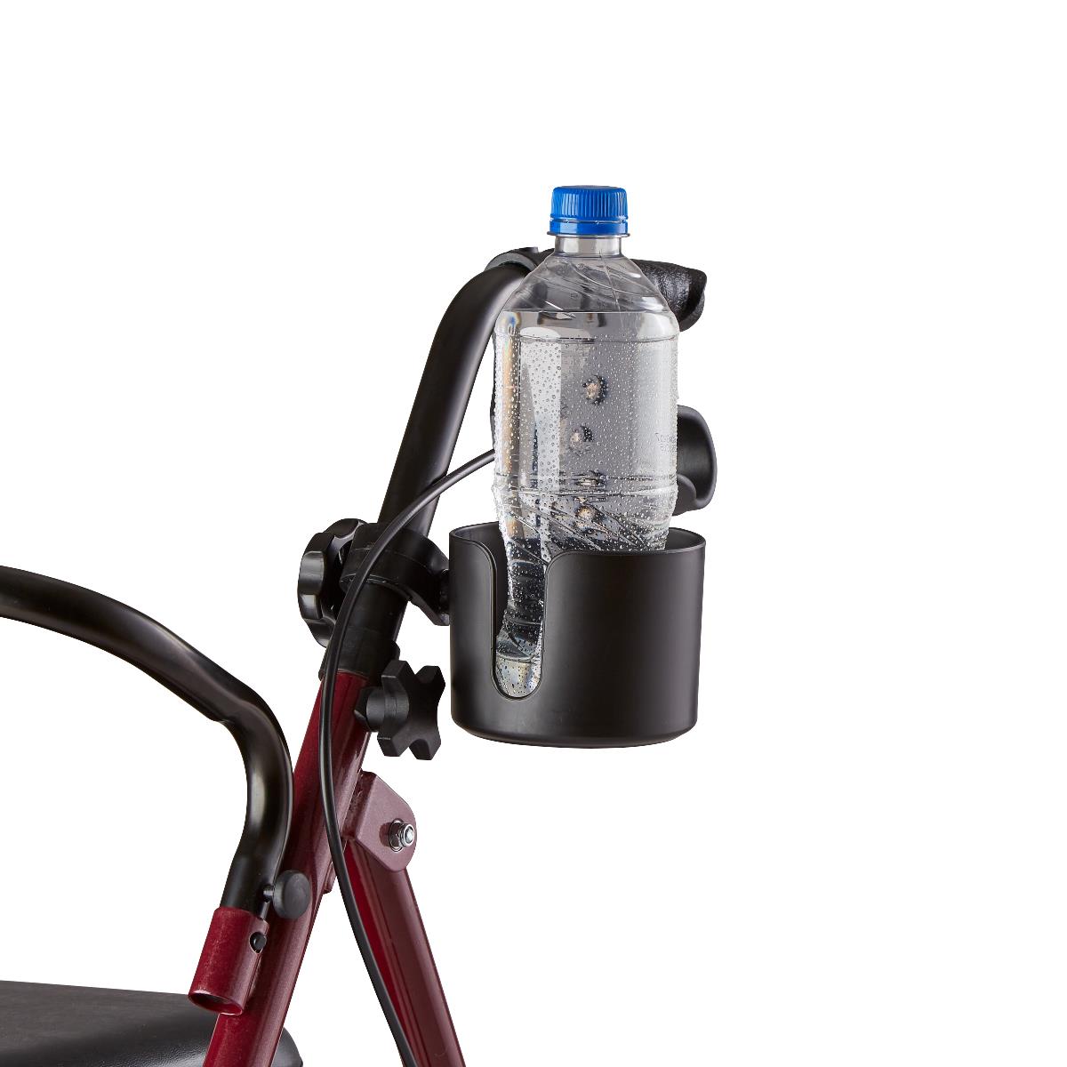 Cup holder with clamp mount attached to a rollator frame, holding a clear plastic water bottle with blue cap