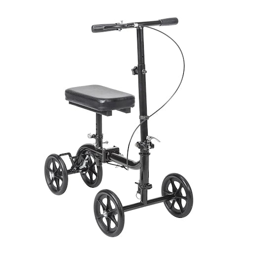 Knee walker with black frame, padded knee rest, T-bar handlebar, hand brake, and four spoke wheels on white background