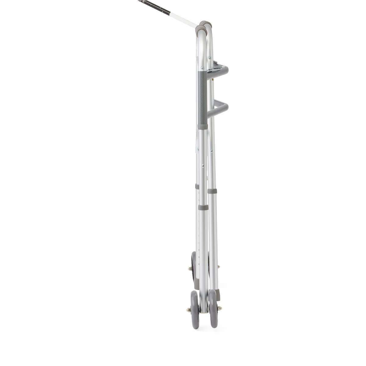 Bariatric walker shown folded flat from the side, silver aluminum frame with gray wheels and hand grips visible