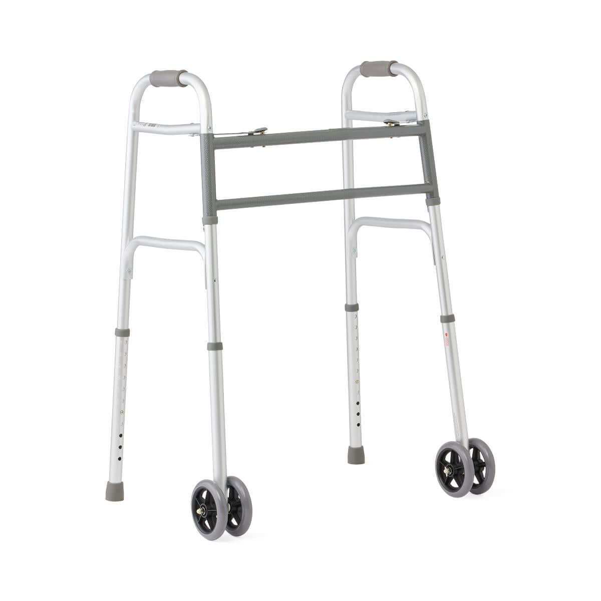 Folding bariatric walker with dual front wheels, gray padded handles, adjustable legs, and rubber-tipped rear feet on white