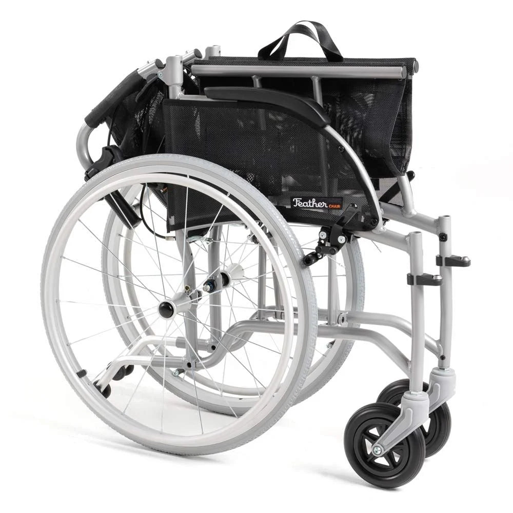 Lightweight wheelchair with silver aluminum frame, mesh back, spoke wheels, and swivel front casters, viewed from rear angle
