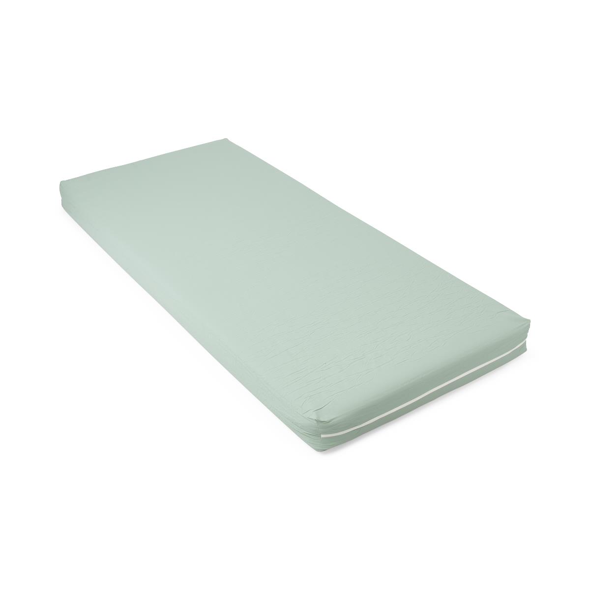 Hospital bed foam mattress with light green cover and white piping, shown on white background