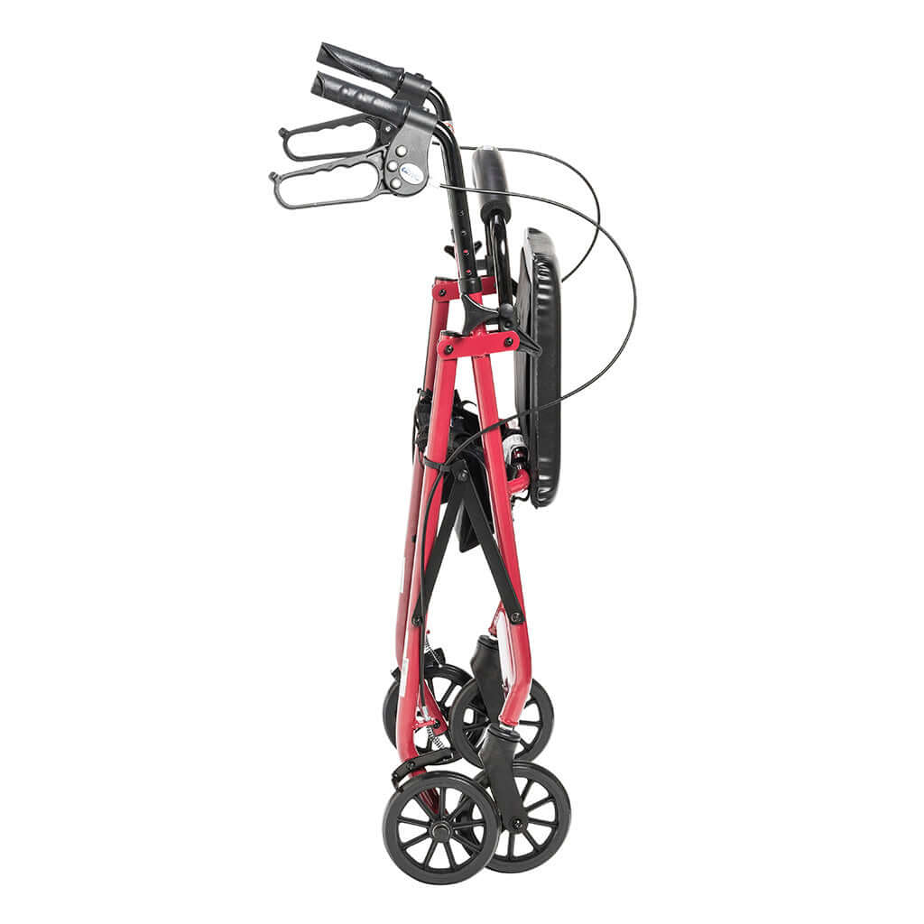 Rollator walker in folded position, side view, red aluminum frame with black handles, brake cables, padded backrest, and