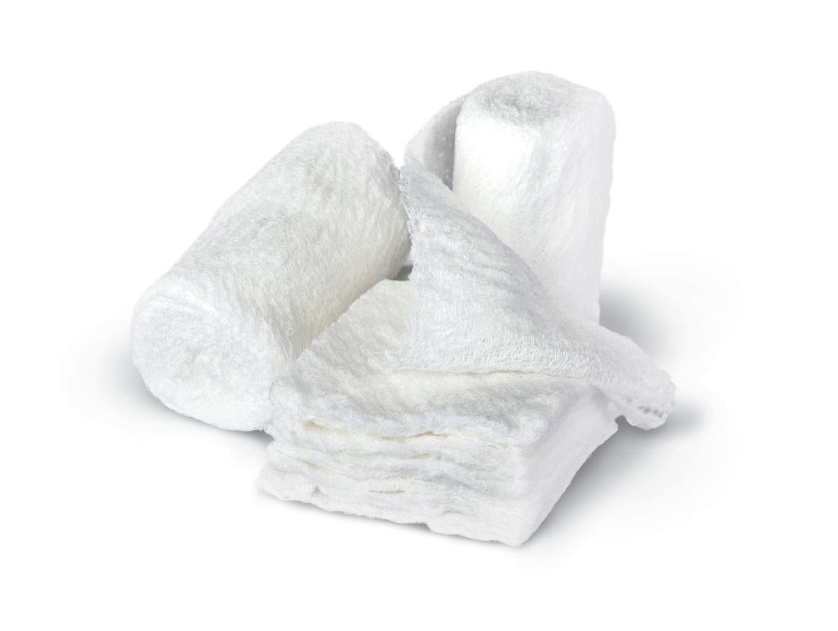 Cotton gauze bandage rolls, two rolled and one partially unrolled, white fluffy texture on white background