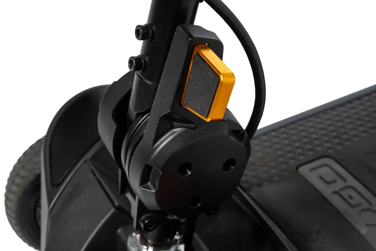 Power scooter front wheel hub and suspension assembly with black frame and gold accent brake component detail