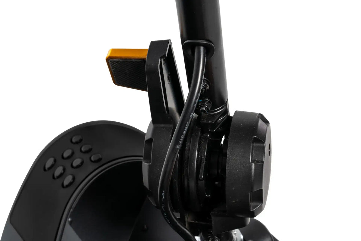 Power scooter tiller assembly close-up showing brake lever, wiring, and adjustment knob with orange accent detail
