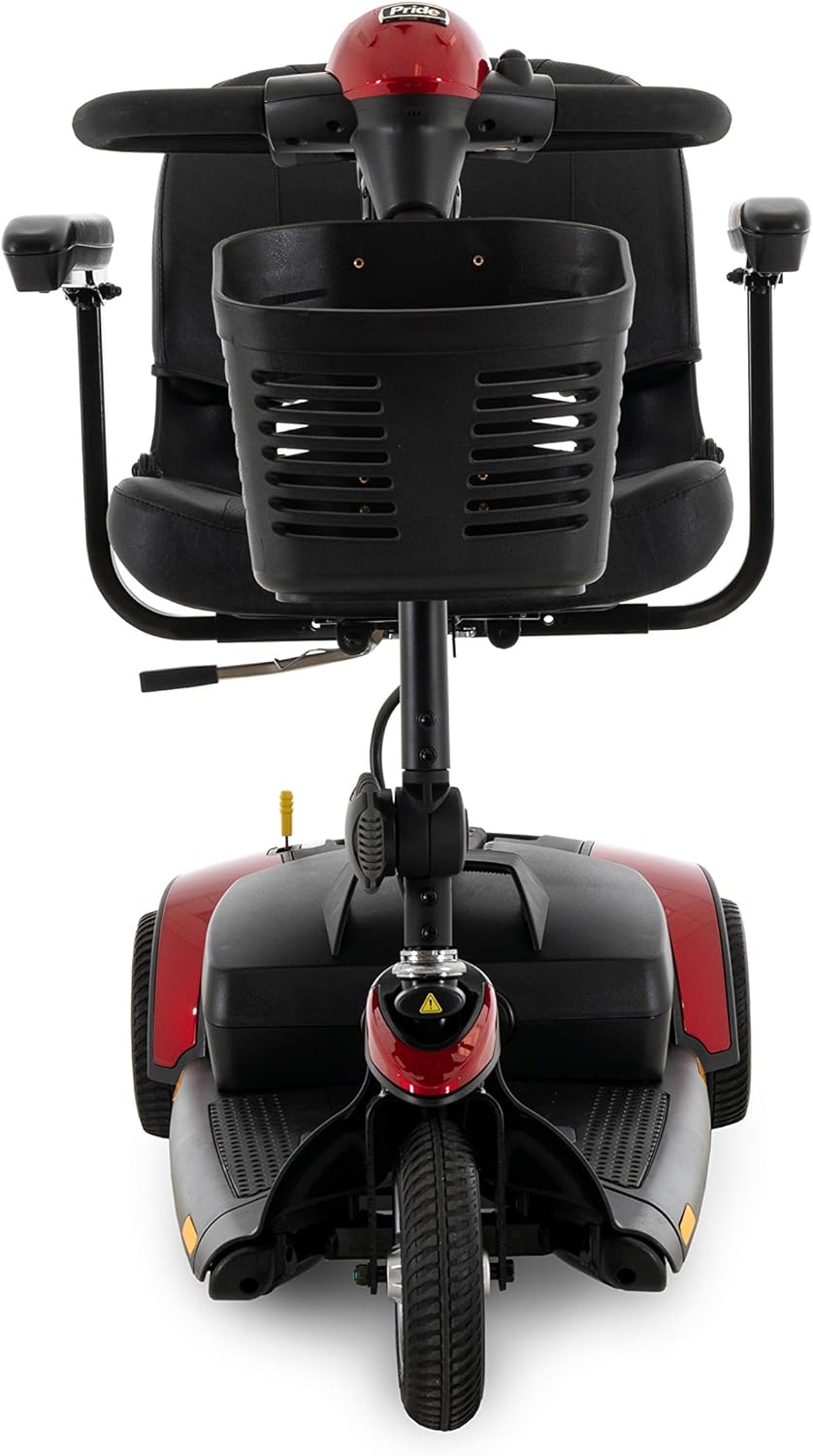 Power mobility scooter, rear view showing black padded seat, storage basket, tiller, and red and black body with three wheels