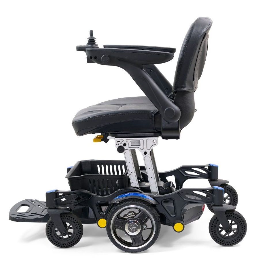 Power wheelchair with black upholstered seat, joystick controller, four wheels with blue accents, and footrest, shown from