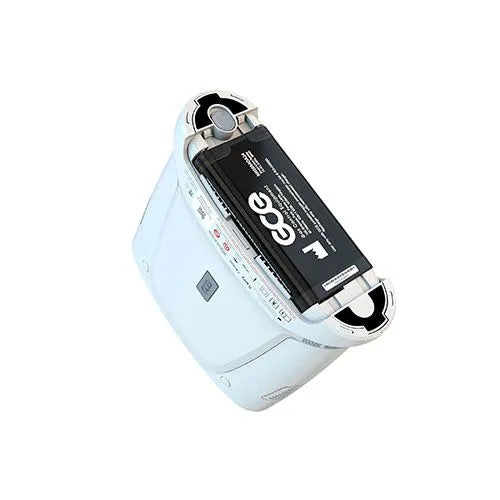 Portable oxygen concentrator shown tilted with battery compartment open, revealing removable black battery pack