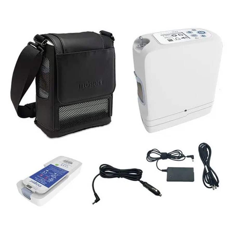 Inogen G5 portable oxygen concentrator bundle with black carry bag, battery, AC power supply, and DC car charger