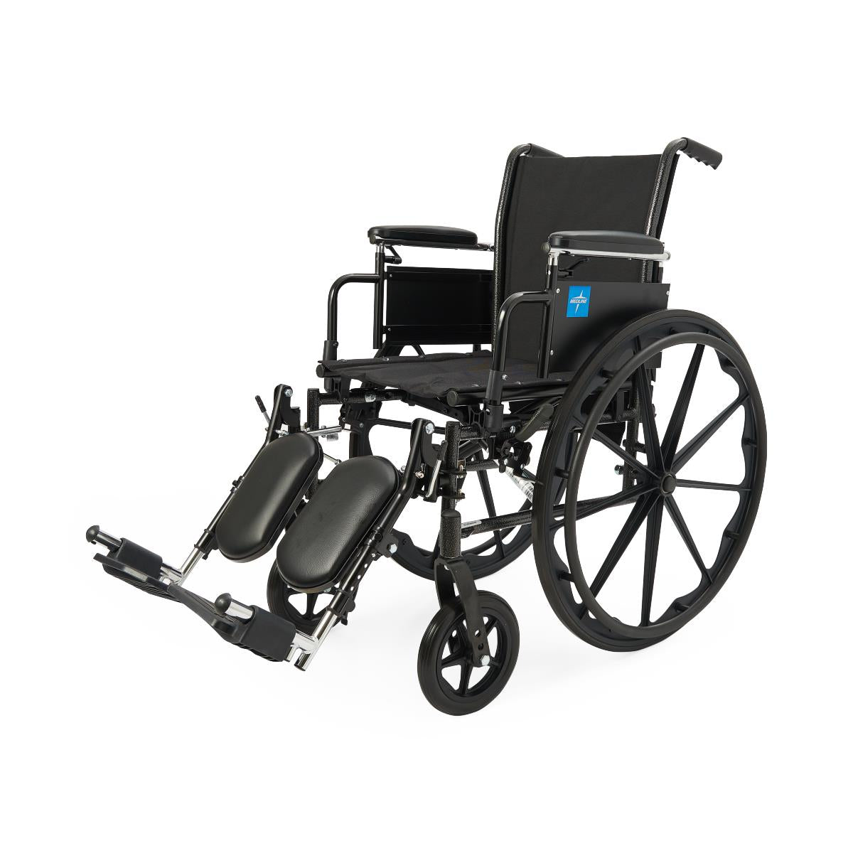 Wheelchair with black nylon upholstery, padded armrests, elevating leg rests, and large rear wheels, shown at an angle on