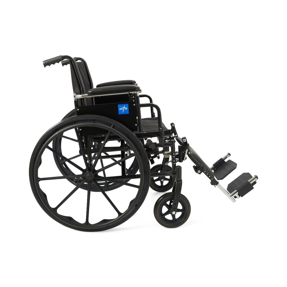 Wheelchair with black nylon upholstery, large rear wheels, swing-away footrests, and flip-back armrests, shown from the side