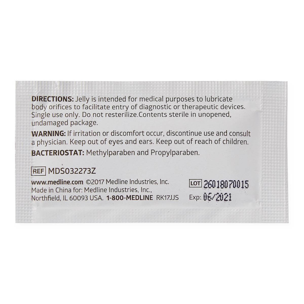 Back of a single-use sterile lubricating jelly packet showing directions, warnings, and lot information on white foil