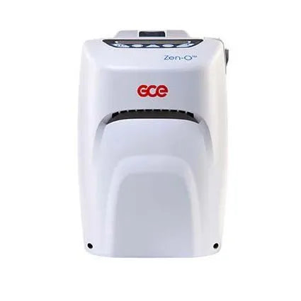Portable oxygen concentrator, white GCE Zen-O unit with front vents, carry handle, and control panel on top