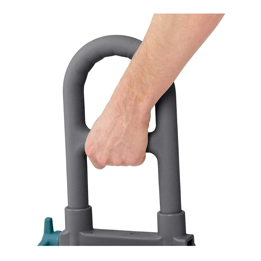 Bathtub grab bar handle close-up with a hand gripping the gray U-shaped support rail and teal base visible below
