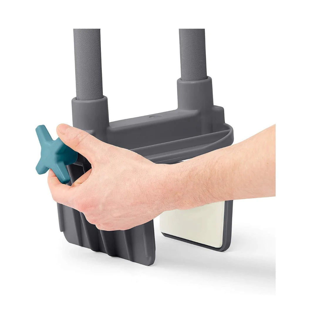Bathtub grab bar base showing a hand tightening a teal star-shaped knob to secure the gray clamp-style mounting bracket