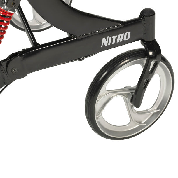 Nitro HD rollator close-up showing black aluminum frame, large silver spoke front wheel, and red coil spring suspension