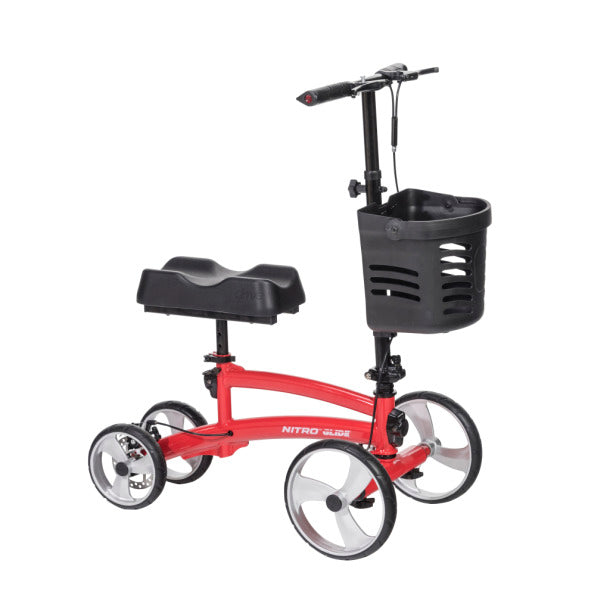 Knee walker with red frame, padded knee rest, four wheels, hand brakes, adjustable handlebar, and front storage basket