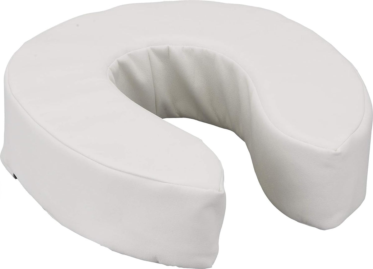 Padded raised toilet seat cushion with white vinyl cover and open front design, shown at an angle