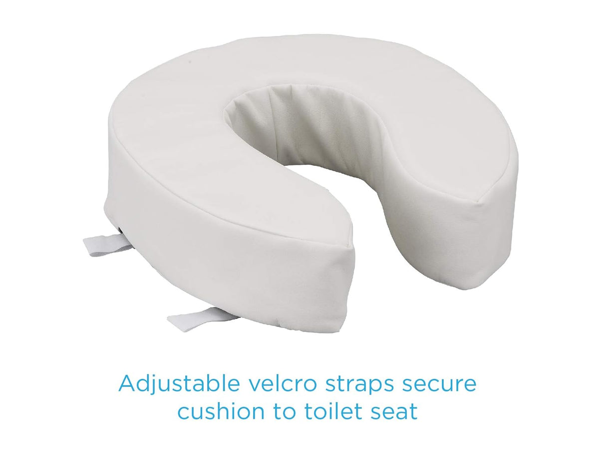 Padded toilet seat cushion with open front design and adjustable Velcro straps, shown in white vinyl cover on white