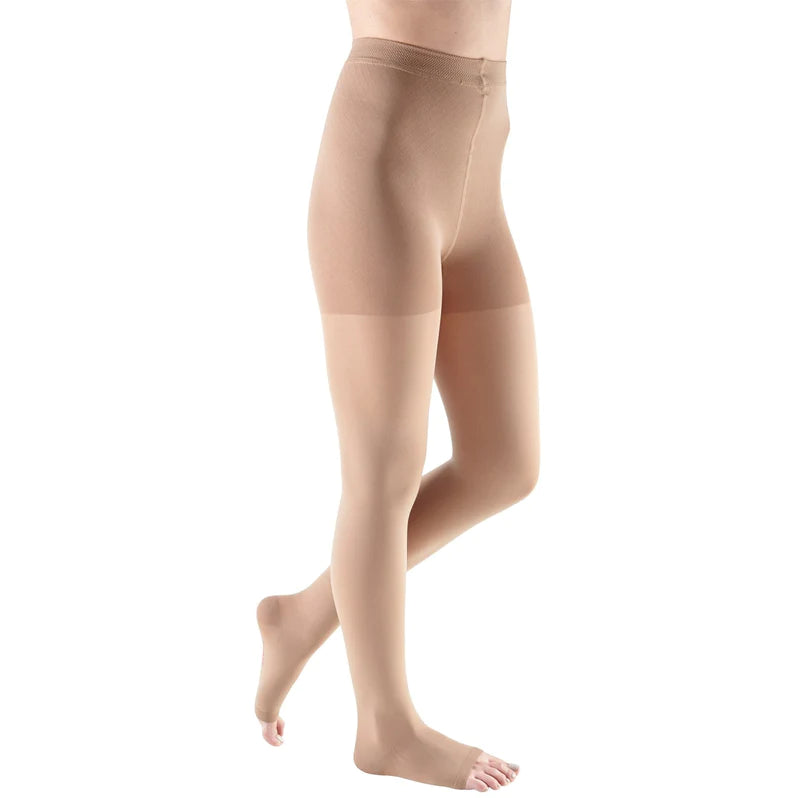 Compression pantyhose in beige with open toe and adjustable waistband, shown on a model from the waist down against a white
