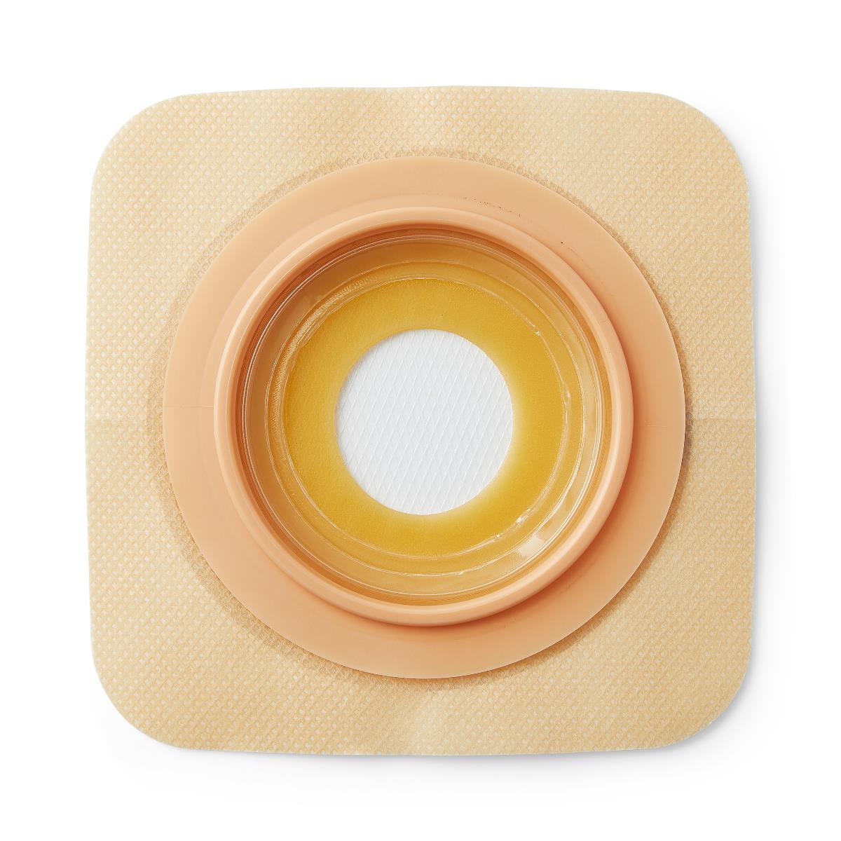 Ostomy barrier wafer with square beige adhesive backing, circular convex flange, and amber hydrocolloid ring surrounding a