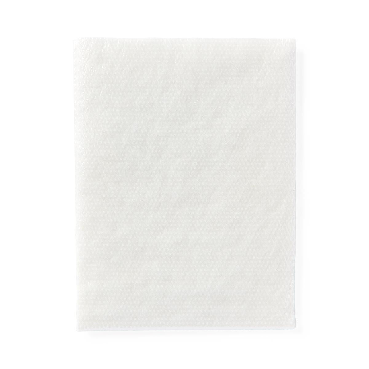 Non-adherent sterile pad with white textured surface, shown flat against a white background