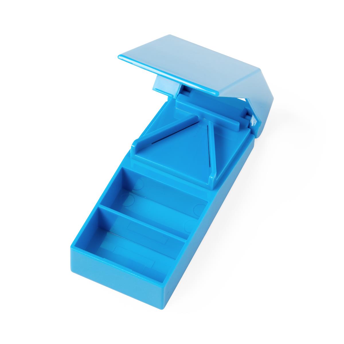 Pill splitter in blue plastic with open lid revealing a V-shaped cutting blade and storage compartment below