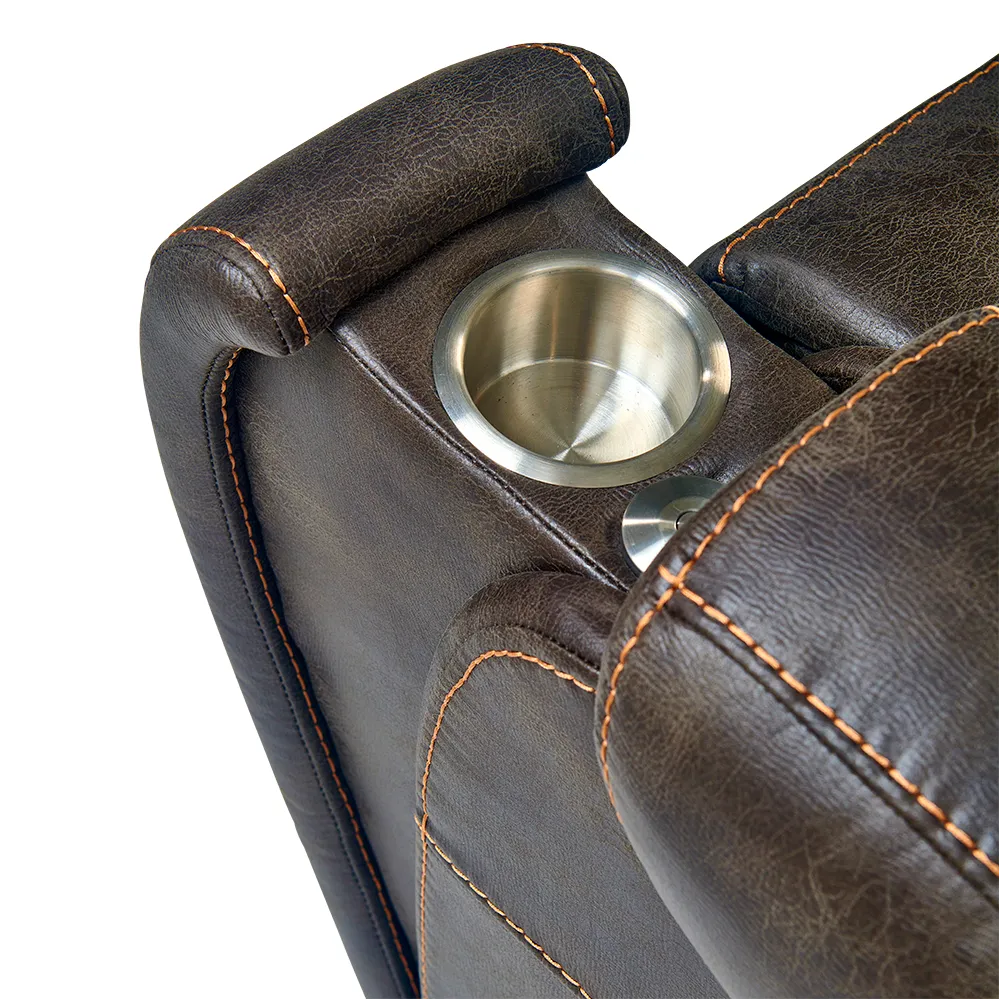 Lift chair armrest detail showing a stainless steel cup holder built into dark brown faux leather upholstery with contrast