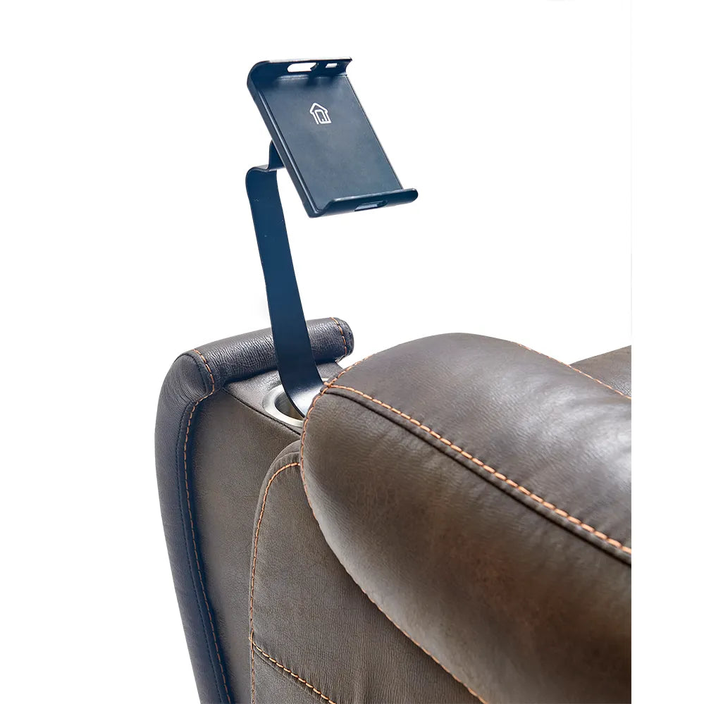 Tablet holder arm mount clipped to the armrest of a brown leather lift chair recliner