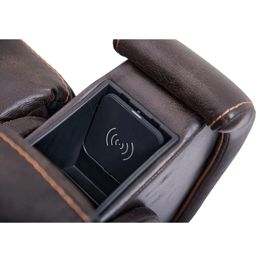Lift chair armrest closeup showing built-in wireless charging pad recessed into dark brown faux leather upholstery