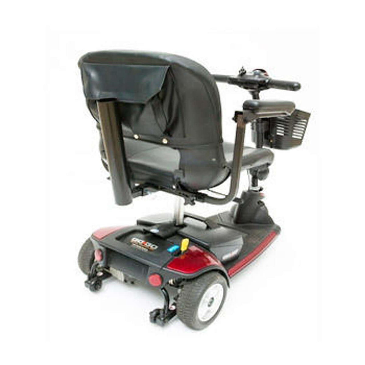 Power mobility scooter cane and crutch holder accessory mounted to the rear of a red and black 3-wheel mobility scooter