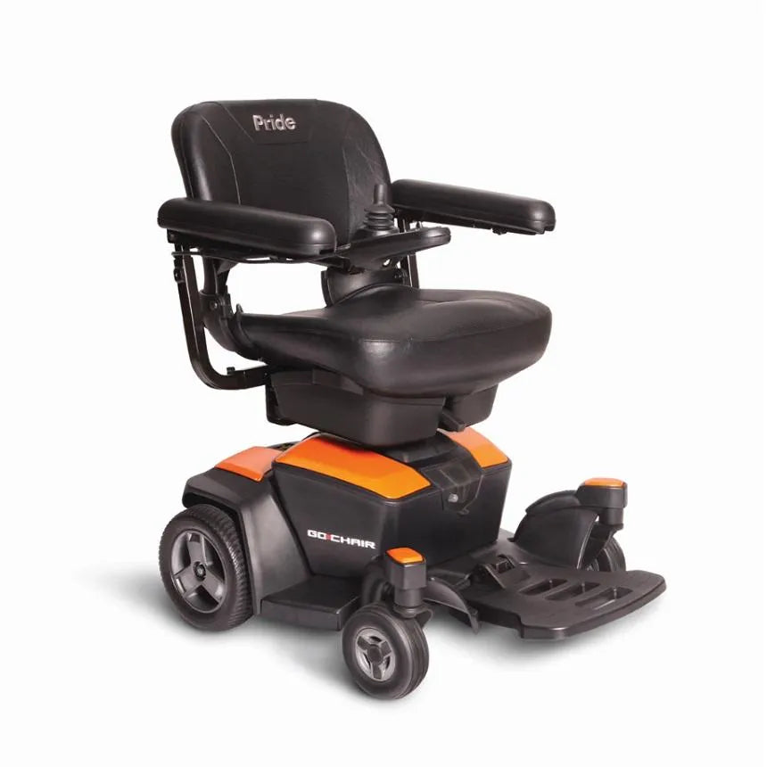 Pride Go Chair power wheelchair with black upholstered seat, joystick armrest, footrest, and orange and black base on four