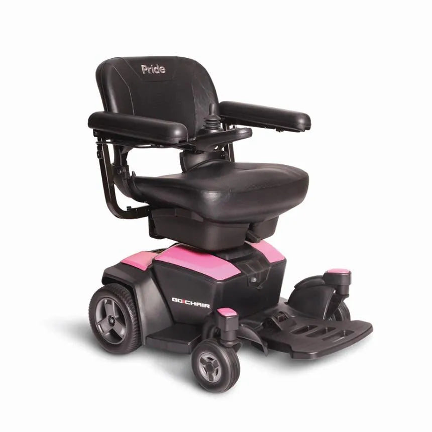 Pride Go Chair power wheelchair with black padded seat and armrests, joystick control, pink accent panels, and four wheels