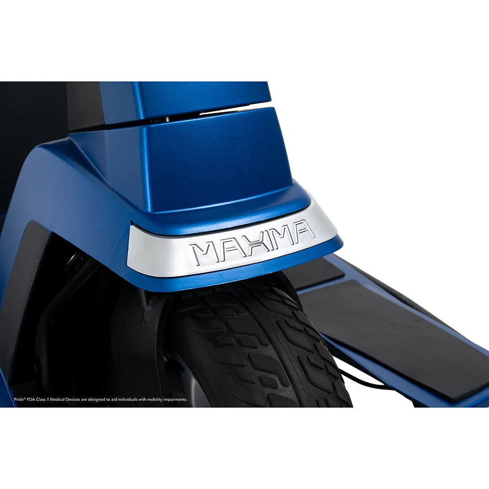 Power scooter front fender closeup in blue with silver Maxima nameplate badge and large treaded tire visible
