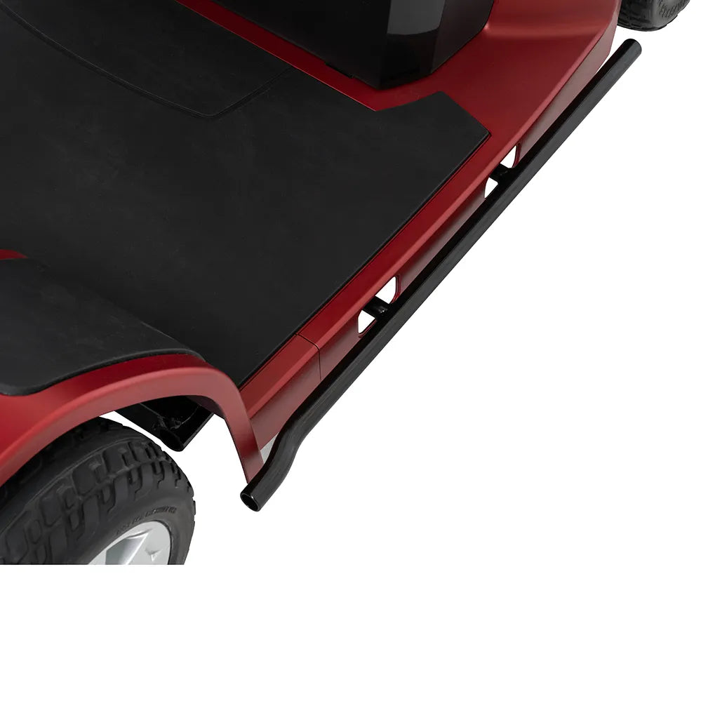 Power scooter side floorboard and body panel detail showing black non-slip deck, red frame, and rear wheel