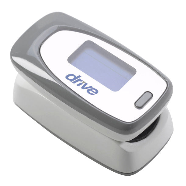 Fingertip pulse oximeter in gray and white with LCD display and Drive branding, shown open at an angle