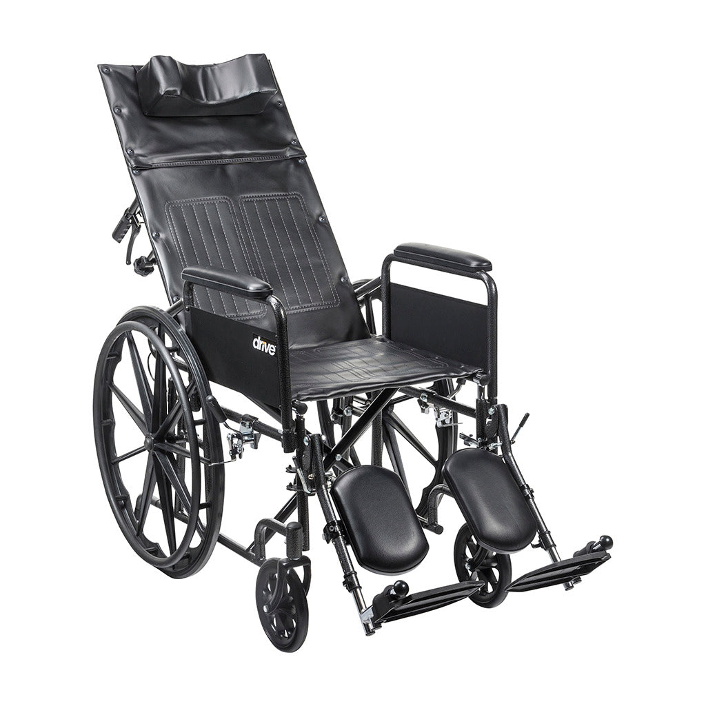 Reclining wheelchair with tall padded back, headrest, padded armrests, elevating leg rests, and black steel frame with large