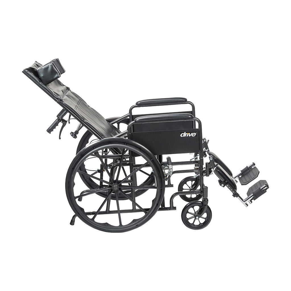 Reclining wheelchair with fully reclined back, headrest, elevating leg rests, and black frame, shown from the side