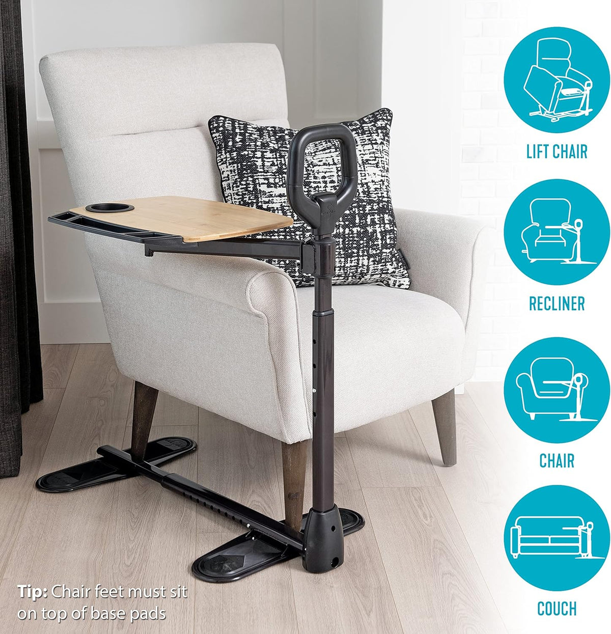 Stander Assist-A-Tray floor stand with bamboo swivel tray and grab handle beside a white armchair, compatible with lift