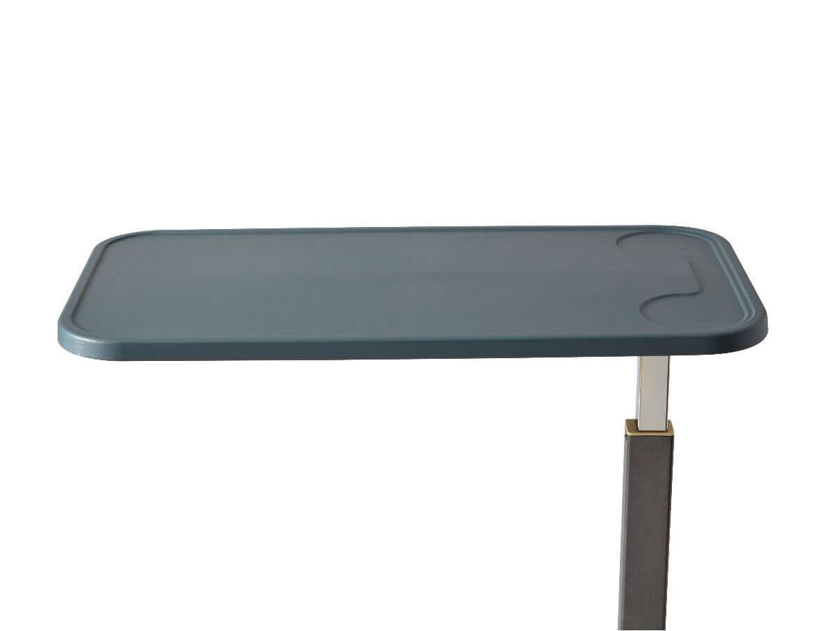 Overbed table with a flat teal composite top, recessed handle cutout, and adjustable metal support pole