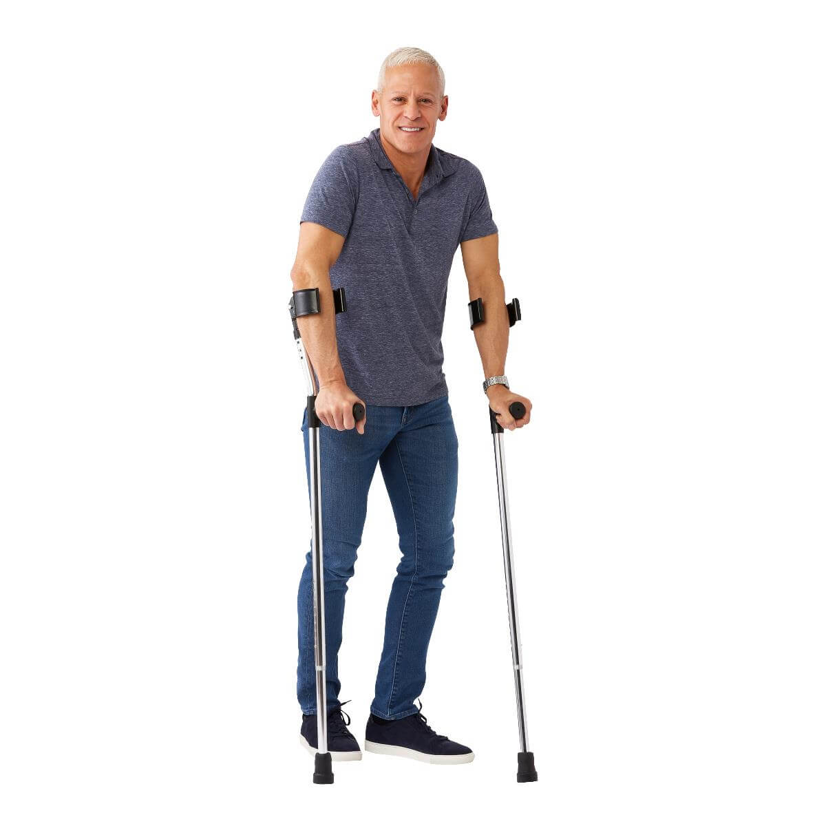 Guardian forearm crutches shown in use by a smiling older man in jeans and a gray polo shirt against a white background